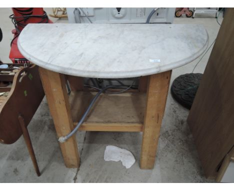 A work bench and marble wash stand top