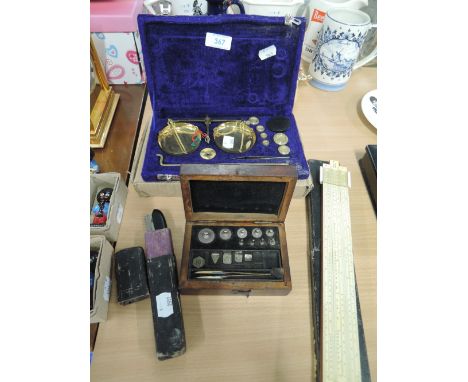 A selection of vintage gold balance and weighing scales and unusual razor blade