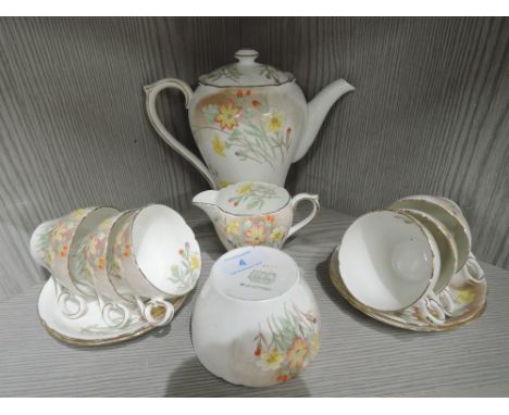 A vintage art deco tea service by Shelley with hand decorated floral design rdno. 823343