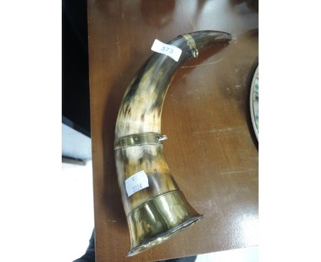 A vintage hunting horn with brass fitments