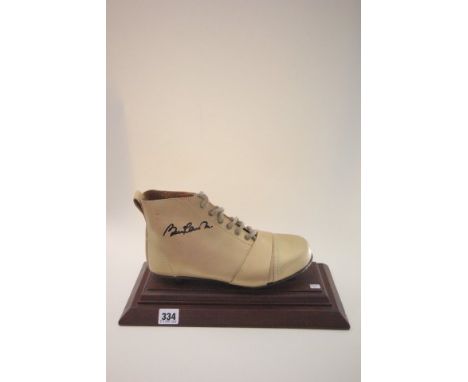 Football Autograph - Vintage style boot on wooden plinth signed by Manchester United's Bobby Charlton