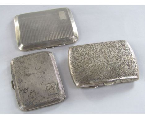 Late Victorian silver cigarette case engraved with scrolled acanthus together with two further engine turned examples, 7.5 oz