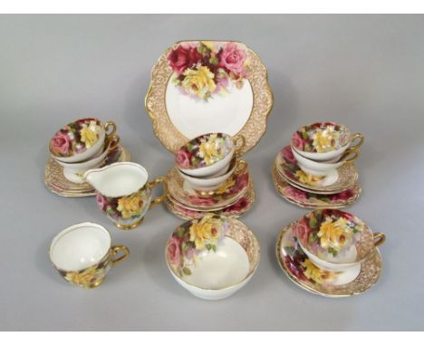 A collection of Stanley bone china tea wares with red and yellow rose decoration comprising milk jug, sugar bowl, cake plate,