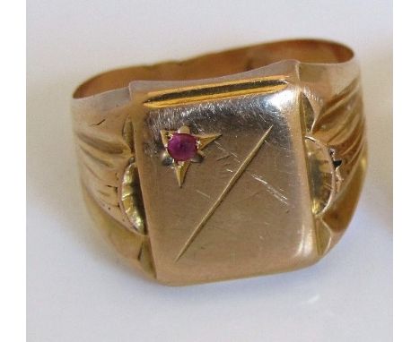 A ruby set signet ring stamped 750, size V, 6.5g