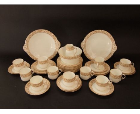 A collection of Grainger's Worcester tea wares with sepia coloured floral detail comprising milk jug, slop bowl, pair of cake