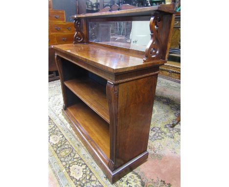 A regency rose wood open book case or chiffonier, with moulded column supports enclosing an adjustable shelf, the raised back