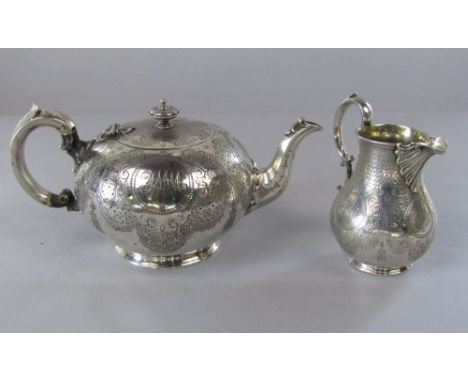 Victorian silver part tea service comprising teapot and baluster milk jug, engraved with various geometric panels and further