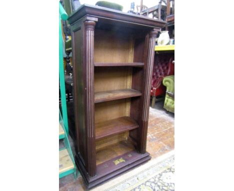 A mahogany floor standing open bookcase with three adjustable shelves flanked by fluted architectural columns, 66cm wide x 12