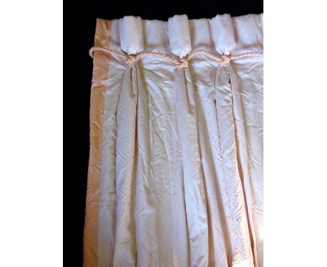 Two pairs of blanket lined curtains with triple pleat heading and rope detail in a cream and peach colourway, with tie backs,