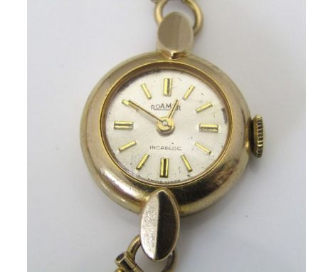 Vintage ladies 9ct Roamer cocktail watch, the champagne dial with gilt baton markers upon a 9ct bracelet