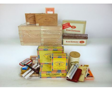 A box containing a large collection of vintage cigars, many unopened