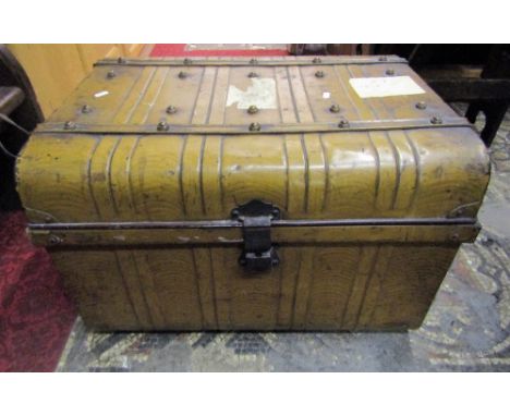 A Victorian domed top tin trunk, with simulated wood grain finish