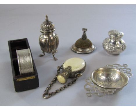 Collection of bijouterie silver to include a silver framed pin cushion mounted by a seated cat, two silver peppers, a silver 