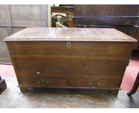 A 19th century oak mule chest with rising lid over two shallow frieze drawers, on bracket supports, 110cm wide