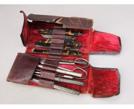 A leather pocket pouch containing a full selection of basic medical instruments, blades, scissors, thermometer, needle, etc