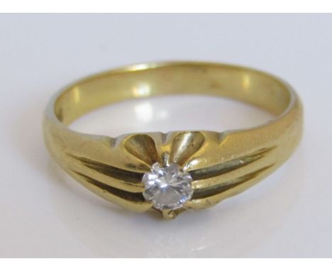 An 18ct diamond solitaire ring in fancy claw setting, the diamond 0.20cts approx, size S, 5.5g