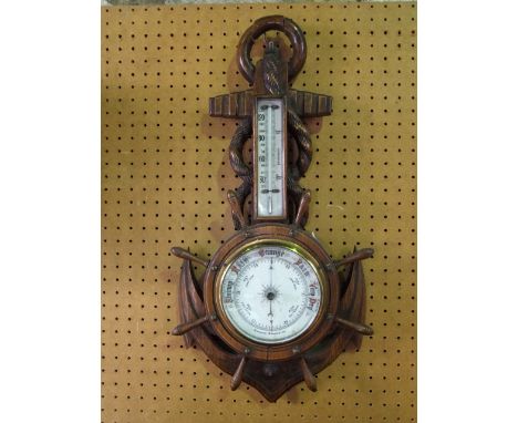 Oak cased aneroid barometer thermometer, in the form of an anchor and ships wheel