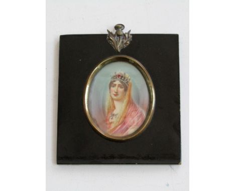 An early 20th century portrait miniature of oval form, bust length portrait of a lady in jeweled coronet and necklace, wearin