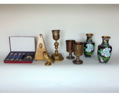 A box of interesting items to include a pair of cloisonne vases, a metronome, a brass and white metal chalice and others