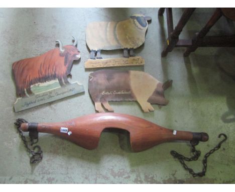A vintage two man cross cut saw with ash wood handles, a yoke, a turf knife and three contemporary novelty wall hanging hand 