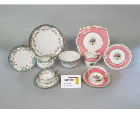 A collection of Foley china pink ground tea wares with flower basket detail comprising milk jug, pair of cake plates, twelve 