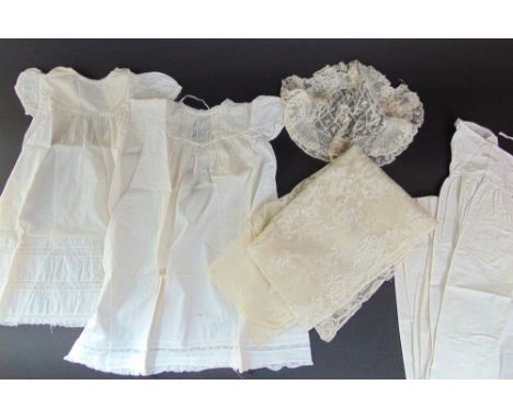 A collection of Victorian white cotton garments, some marked "Busk" including 5 long child gowns, some with smocking (AF), 4 