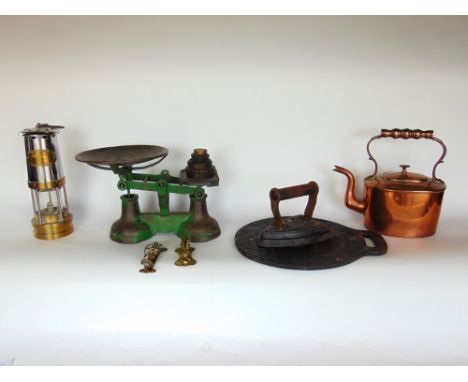 A collection of metalware to include a brass and chrome miners lamp, set of domestic scales, an iron, copper kettle, etc