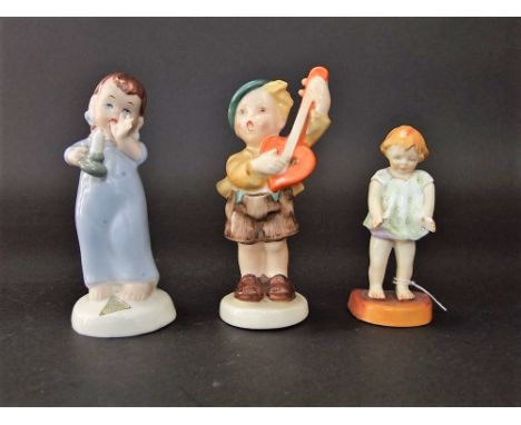 A Royal Worcester model of Joan, by F G Doughty, number 2915 to base, together with a Goebel figure of a musician, possibly a
