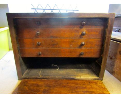 A vintage engineers wooden portable tool chest with removable door front enclosing partially fitted interior of small drawers