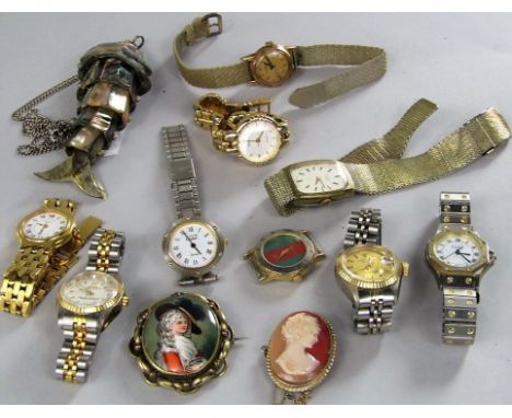 A box of various vintage wrist watches to include reproduction Rolex and Cartier; together with a cameo brooch, a porcelain b