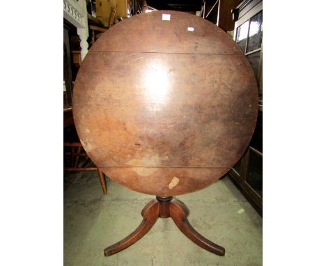 A 19th century mahogany snap top table raised on a turned pillar and tripod base