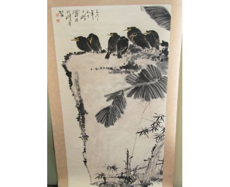 A Chinese scroll or wall hanging showing seven young crows on a ledge, with bamboo and other foliage to the foreground, signe