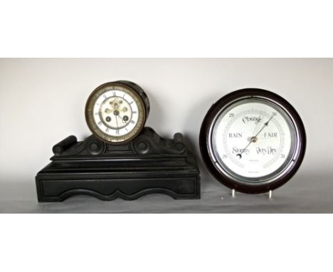 19th century black slate mantle clock, with two train movement with open escapement and enamel chapter ring, upon a scrolled 