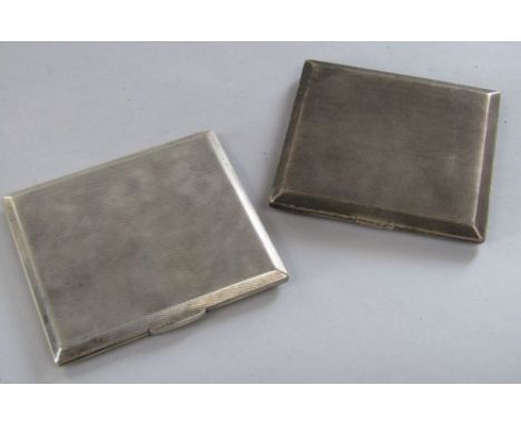 Two engine turned silver cigarette cases, 9.5 oz approx