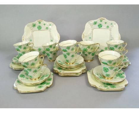 A quantity of Grafton China Blossoms pattern art deco tea wares in green and gilt colourway comprising milk jug, sugar bowl, 