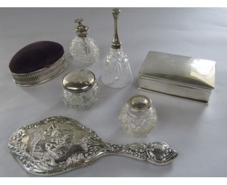 A mixed collection of silver to include a silver cigarette box, a silver dressing mirror embossed with romantic scene, four s
