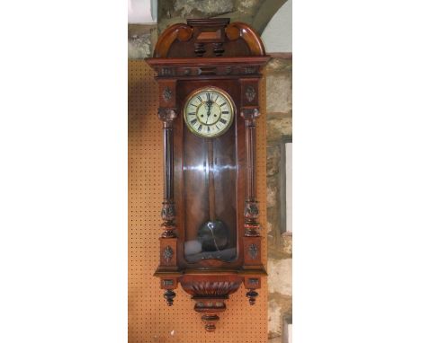 Vienna regulator style wall clock, the two train enamel dial with pendulum, weights and architectural case with pilasters 