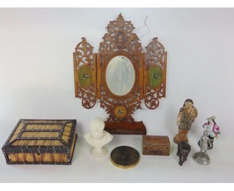 A Sorrento triptych wall bracket, the hinged doors enclosing an oval mirrored plate with typical pierced decoration and furth