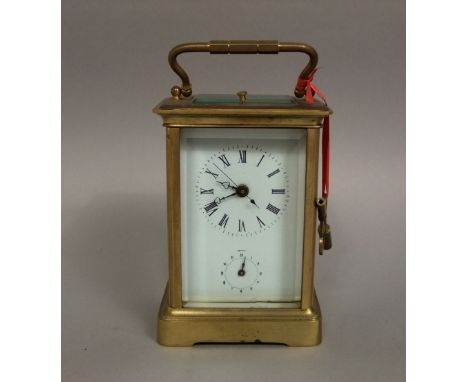 A good 19th century brass cased repeater carriage clock, with bevelled glass, subsidiary second dial, open escapement, with f