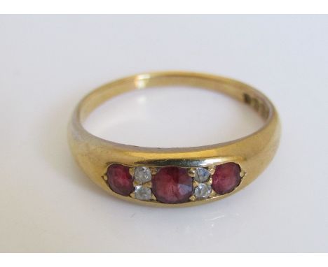 An 18ct diamond and ruby ring, size R, 4.5g