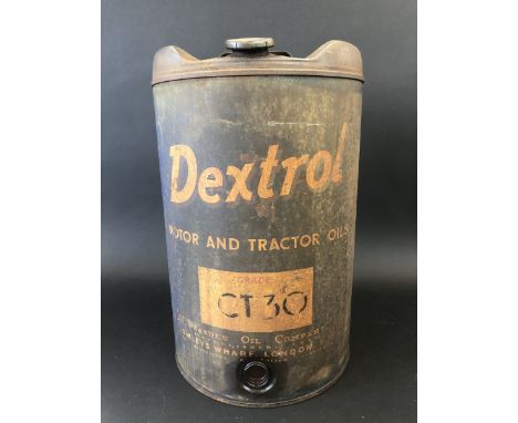 A Dextrol Motor and Tractor Oils five gallon cylindrical drum. 