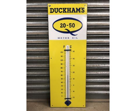 A Duckham's 20-50 Motor Oil enamel thermometer, in good condition, 13 x 36".