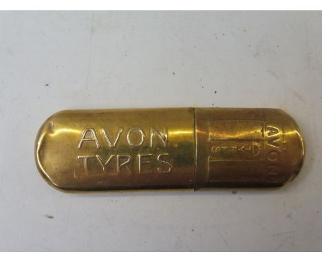 A rare Avon Tyres brass lighter, embossed to both sides.