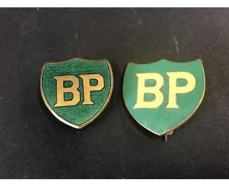 Two BP enamel lapel badges.