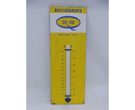 A Duckham's 20-50 Motor Oil enamel thermometer, 13 x 36".