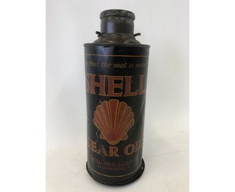 A Shell Gear Oil cylindrical quart can with original cap on bulkhead bracket.