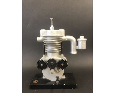 A Continental cut-away display model of a motorcycle engine, stamped with the maker's name for Budapest.
