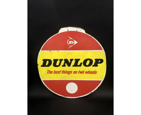 A Dunlop circular hardboard advertisement, 23 1/2" diameter.