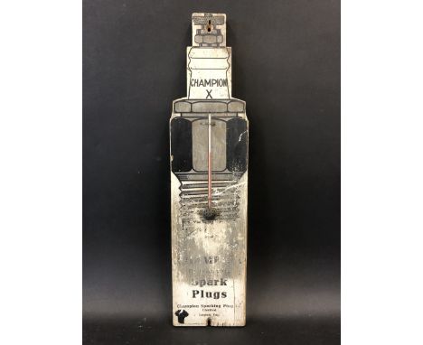 An unusual Champion Spark Plugs wooden thermometer in the shape of a spark plug, 5 1/4 x 21".