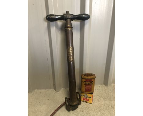 A Dunlop Double Action Pump No.1 plus a Dunlop Major Patch Strip outfit tin and an Autotherm Vulcanising Heat Patch tin.